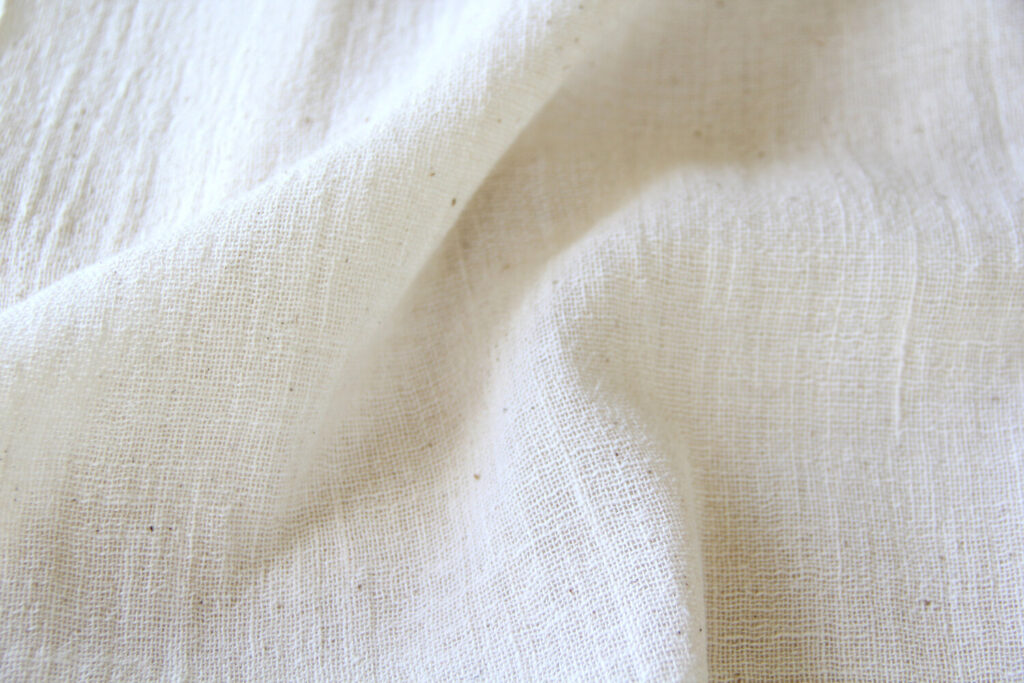 Best Fabrics for Custom Tote Bags. Close-up image of organic cotton fabric.

